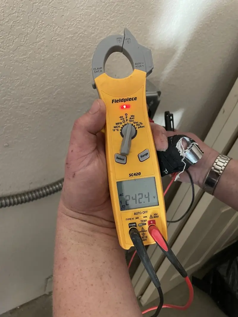 Voltage testing with clamp meter during Outlet Installation in Troy